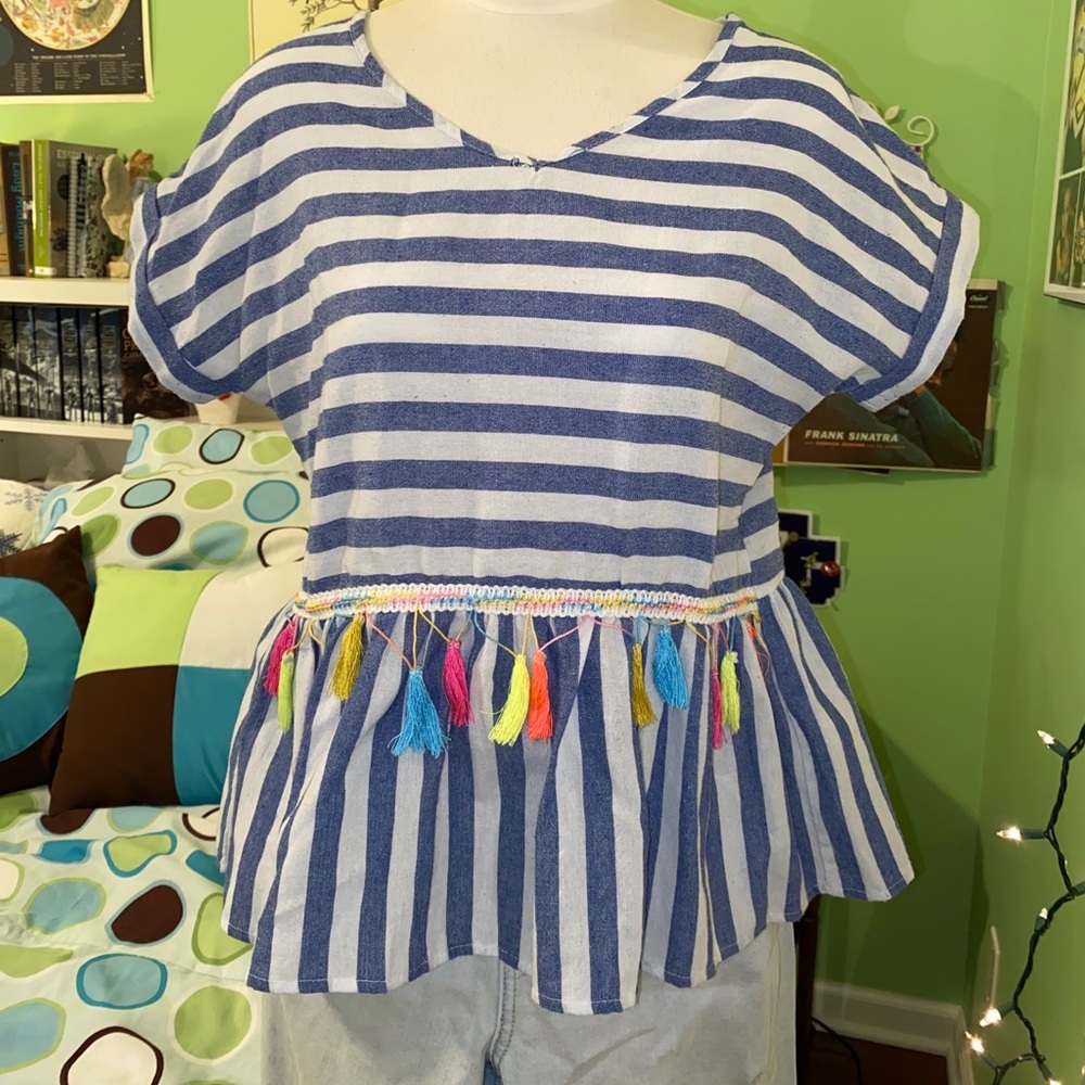 White and blue shirt with multicolored tassels